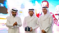 Nasser Al-Kuwari (centre) poses with QMMF and LIC President Abdulrahman bin Abdullatif Al-Mannai (left) and Undersecretary of the Ministry of Sports and Youth Engineer Yasser bin Abdullah Al-Jamal at his felicitation function.