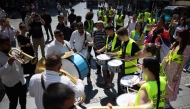 Students and street musicians perform during a May Day (Labour Day) rally, marking International Workers' Day, in Belgrade, on May 1, 2025. (Photo by OLIVER BUNIC / AFP)