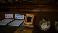 A Point of Sale (POS) device (C) is pictured at the Catholic Church of St Dionysius the Areopagite in Athens on May 4, 2025. Photo by Aris MESSINIS / AFP