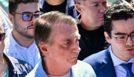 Former Brazil's President Jair Bolsonaro leaves the DF Star clinic in Brasilia on May 4, 2025, three weeks after undergoing a 12-hour operation to treat an intestinal obstruction, a complication from a stab wound he suffered in 2018 during a campaign event weeks before he won the presidential election. (Photo by EVARISTO SA / AFP)