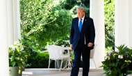 President Donald Trump exits the Oval Office for an event for the National Day of Prayer in the Rose Garden on Thursday. MUST CREDIT: Demetrius Freeman/The Washington Post
