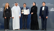 CEO of Qatar CSR National Programme, Dr. Saif Ali Al Hajari (second left) hands over the award to Shanavas P.M., Regional Director of LuLu Hypermarket Qatar.
