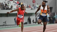 South Africa’s Akani Simbine (left) and Jamaica’s Kishane Thompson compete in men’s 100m yesterday. 