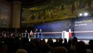 (From L) French President Emmanuel Macron, European Commission President Ursula Von der Leyen and EU Commissioner for Startups, Research and Innovation Ekaterina Zaharieva listen to the speech delivered by France's Minister in charge of Higher Education and Research Philippe Baptiste during the 