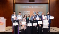 A group of award-winning students with their mentors.
