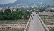 A general view of a partially deserted bridge leading to the Indian-run main town of Poonch on May 8, 2025. (Photo by Punit Paranjpe / AFP)
 