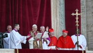 Newly elected Pope Leo XIV, Robert Prevost arrives on the main central loggia balcony of the St Peter's Basilica for the first time, after the cardinals ended the conclave, in The Vatican, on May 8, 2025. (Photo by Tiziana Fabi / AFP)

