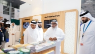 Minister of Awqaf and Islamic Affairs H E Ghanem bin Shaheen bin Ghanem Al Ghanim visiting the ministry's pavilion at Doha International Book Fair yesterday.