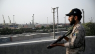 A security personnel stands guard near the Karachi Port in Karachi on May 9, 2025, amid the ongoing border tensions between India and Pakistan after the Kashmir tourist attack. Photo by Rizwan TABASSUM / AFP.