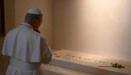 This photo taken and released on May 10, 2025 by The Vatican Media shows Pope Leo XIV paying his respects to late Pope Francis in front of his tomb at Santa Maria Maggiore Basilica in Rome. (Photo by Handout / Vatican Media / AFP)