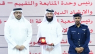 Dawah Department official receiving the award during the ceremony.  