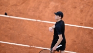 Italy's Jannik Sinner throws his cuff to the public as he celebrates winning against Netherland Jesper De Jong at the end of their round of 16 men's singles match of the WTA Rome Open tennis tournament at Foro Italico in Rome on May 12, 2025. (Photo by Marco BERTORELLO / AFP)
