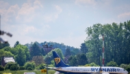 A Ryanair airplane coming from Porto is at standstill on the runway after a bomb alert at the Brussels South Charleroi Airport (BSCA) in Gosselies, on May 13, 2025. (Photo by VIRGINIE LEFOUR / Belga / AFP)