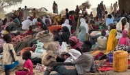 (FILES) People who fled the Zamzam camp for the internally displaced after it fell under RSF control, rest in a makeshift encampment in an open field near the town of Tawila in war-torn Sudan's western Darfur region on April 13, 2025. (Photo by AFP)

