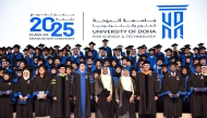Chairman of UDST Board of Trustees Dr. Mohammed bin Saleh Al-Sada and UDST President Dr. Salem Al-Naemi with faculty and students during a graduation ceremony. 