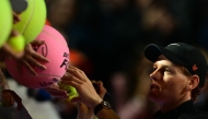TOPSHOT - Italy's Jannik Sinner signs autographs after his men's singles semi-final match against USA's Tommy Paul at the ATP Rome Open tennis tournament at Foro Italico in Rome on May 16, 2025. (Photo by Tiziana FABI / AFP)
