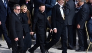 Ukraine's President Volodymyr Zelensky (2ndR) and his wife Elena arrive to attend a Holy Mass for the Beginning of the Pontificate of Pope Leo XIV, in St Peter's square in The Vatican on May 18, 2025. (Photo by Isabella Bonotto / AFP)