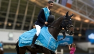 Hussain Saeed Haidan celebrates after winning the Al Shaqab Champions (130cm) CSI1* class. 
