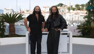 Palestinian director and screenwriter Tarzan Nasser and Palestinian director and screenwriter Arab Nasser pose during a photocall for the film 