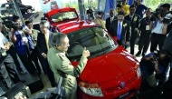 In this file photo, former Malaysian Prime Minister Mahathir Mohamad gives a thumbs-up sign during the launch of the Proton Savvy, the national carmaker's new model in Kuala Lumpur on June 8, 2005. AFP / Tengku Bahar / File photo

