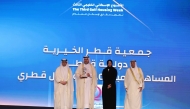 Minister of Social Development and Family H E Buthaina bint Ali Al Jabr Al Nuaimi with officials during the award ceremony.