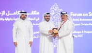 Ahmed Hassan Al Obaidly, Director-General of the National Statistics Centre at the National Planning Council with other officials during the forum.