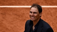 Former Spanish player Rafael Nadal smiles during a ceremony honoring his career on Court Philippe-Chatrier as part of the French Open tennis tournament at the Roland-Garros Complex in Paris on May 25, 2025. (Photo by JULIEN DE ROSA / AFP)
