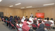 Students attend a lecture by Islamic Cultural Center at a school. 
