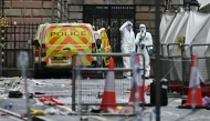 Police forensics officers work at the scene on Water Street in Liverpool, north-west England on May 27, 2025. ( (Photo by Paul ELLIS / AFP)