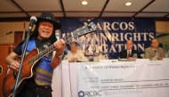 (FILES) Freddie Aguilar, a folk singer who took part in street protests under the late Philippine president Ferdinand Marcos, performs during a ceremony handing out compensation cheques to victims of human rights during the Marcos dictatorship, in Manila on February 28, 2011. (Photo by Ted ALJIBE / AFP)
