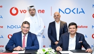 Chief Executive Officer at Vodafone Qatar Sheikh Hamad Abdulla Jassim Al-Thani and President of Cloud and Network Services at Nokia Raghav Sahgal with other officials witnessing the agreement signing.