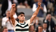 Spain's Carlos Alcaraz celebrates after winning against Hungary's Fabian Marozsan at the end of their men's singles match on day 4 of the French Open tennis tournament on Court Philippe-Chatrier at the Roland-Garros Complex in Paris on May 28, 2025. (Photo by JULIEN DE ROSA / AFP)