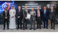 Group Chief Executive Officer at Commercial Bank Joseph Abraham receving the prestigious ISO 22301 certification for Business Continuity Management Systems along with other officials.