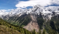 This photograph taken above Wiler shows the Bietschhorn mountain in the Swiss Alps after part of the huge Birch Glacier collapsed. (Photo by Fabrice Coffrini / AFP)