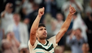 Spain's Carlos Alcaraz celebrates after winning his men's singles match against Bosnia and Herzegovina's Damir Dzumhur on Court Philippe-Chatrier at the Roland-Garros Complex in Paris on May 30, 2025. (Photo by Dimitar Dilkoff / AFP)