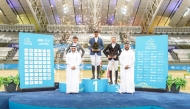 First-place winner Mohammed Saeed Haidan (centre), runner-up Thorsten Wittenberg (left), and third-place finisher Khaled Abdulaziz Al Eid pose on the podium after being crowned the overall top three of the Al Shaqab Champions. 