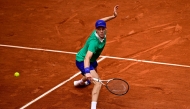 Italy’s Jannik Sinner plays a return to Czech Republic’s Jiri Lehecka.