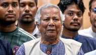 Nobel laureate Muhammad Yunus (C) speaks during a press conference upon his arrival at the Hazrat Shahjalal International Airport in Dhaka on August 8, 2024. (Photo by Munir UZ ZAMAN / AFP)