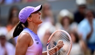 Poland's Iga Swiatek celebrates her victory over Kazakhstan's Elena Rybakina during their women's singles match on day 8 of the French Open tennis tournament on Court Philippe-Chatrier at the Roland-Garros Complex in Paris on June 1, 2025. (Photo by Julien De Rosa / AFP)
