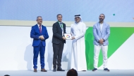 Minister of Communications and Information Technology H E Mohammed bin Ali bin Mohammed Al-Mannai (second right) presenting the award to UDST Vice President, Academic Affairs Dr. Rachid Benlamri (second left), who represented the President of UDST Dr. Salem Al-Naemi at the event.