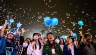 South Koreans cheer during final election campaign event ahead of the upcoming June 3 presidential election in Seoul on June 2, 2025. (Photo by Anthony Wallace / AFP)