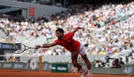 Serbia's Novak Djokovic plays a backhand return to Britain's Cameron Norrie during their men's singles match on day 9 of the French Open tennis tournament on Court Philippe-Chatrier at the Roland-Garros Complex in Paris on June 2, 2025. (Photo by Alain Jocard / AFP)
