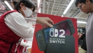 A customers purchases Nintendo Switch 2 at an electronics retailer in Tokyo on June 5, 2025. (Photo by Kazuhiro Nogi / AFP)