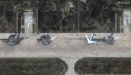 This handout satellite picture courtesy of Maxar Technologies released on June 4, 2025 shows destroyed Tupolev Tu-95 aicrafts at Belaya Airbase near Usolye-Sibirskoye in the Irkutsk Oblast. (Photo by Satellite image ©2025 Maxar Technologies / AFP) /