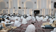 Qatari pilgrims sit inside their camp.