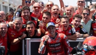 Team Ducati Lenovo Team's Marc Marquez celebrates with his team after winning the MotoGP Aragon Grand Prix race at the Motorland circuit in Alcaniz, northeastern Spain, on June 8, 2025. (Photo by Lluis Gene / AFP)