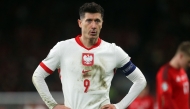(Files) Poland's forward #09 Robert Lewandowski reacts during the UEFA EURO 2024 qualifier play-off between Wales and Poland, in Cardiff, on March 26, 2024. (Photo by Geoff Caddick / AFP)