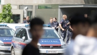 Police stand near a school where several people died in a shooting, on June 10, 2025 in Graz, southeastern Austria. (Photo by Alex Halada / AFP)