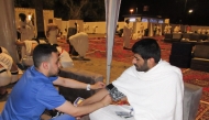 A pilgrim receives medical care provided Qatar Hajj Mission medical teams.