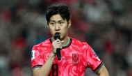 South Korea's Lee Kang-in addresses fans after the team's win against Kuwait on June 10, 2025. (Photo by Jung Yeon-je / AFP)